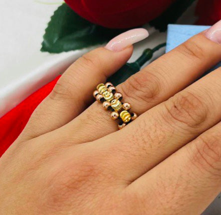 Anillo tejido cruzado balín oro laminado 18k