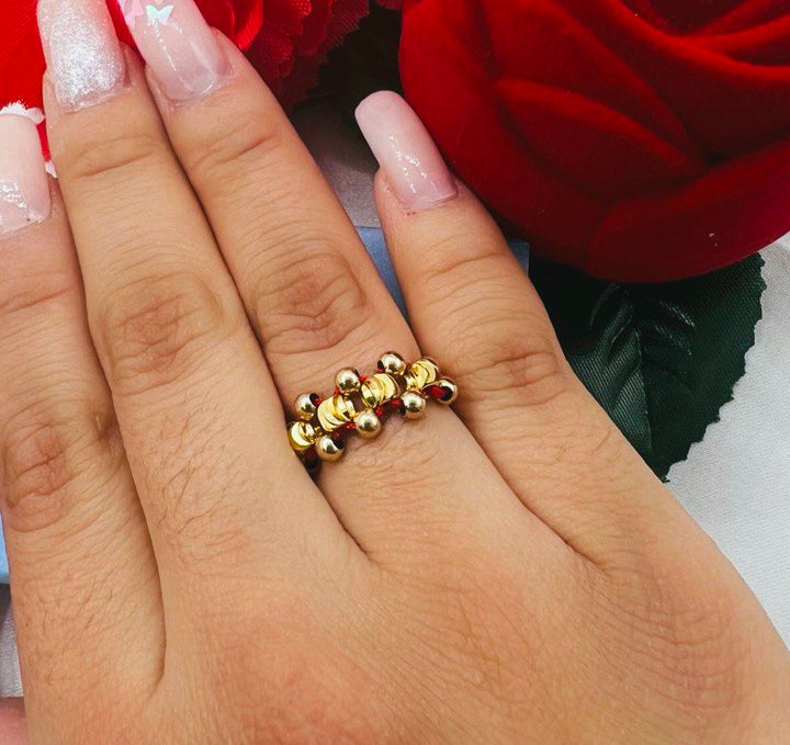 Anillo tejido cruzado balín oro laminado 18k
