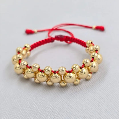 Brazalete Negro con Balin Liso Oro Laminado 18k