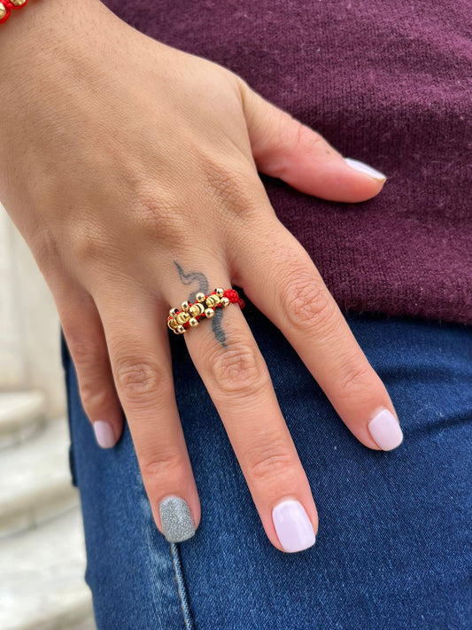 Anillo tejido cruzado balín oro laminado 18k