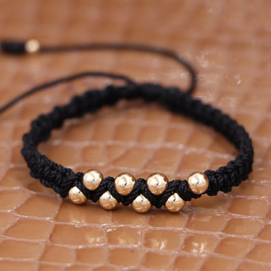 Brazalete Negro Tejido Balín Oro Laminado 18k