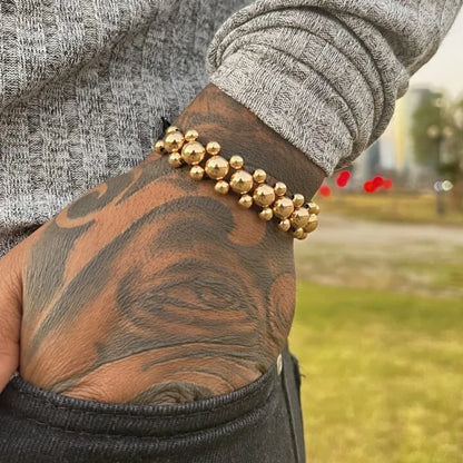 Brazalete Negro con Balin Liso Oro Laminado 18k